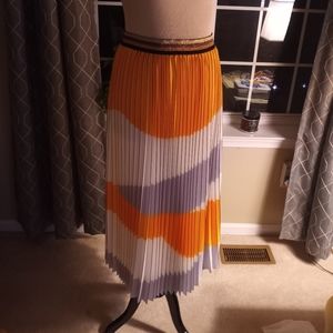 Eva Franco pleated, yellow, white, black skirt.